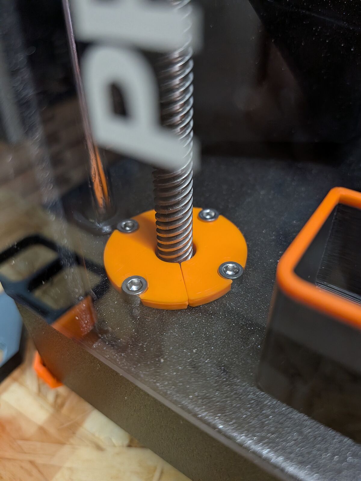 Orange Z-axis dust protector around the lead screw